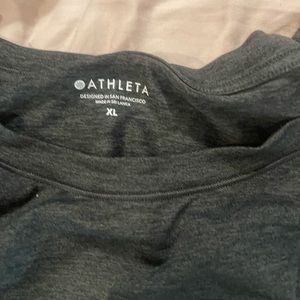 Athleta. Size women’s XL. Moisture wicking shirt with thumbholes.